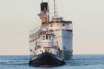 The Tug Wendy Anne towing the SS Keewaitin past the Beaver Archipelago